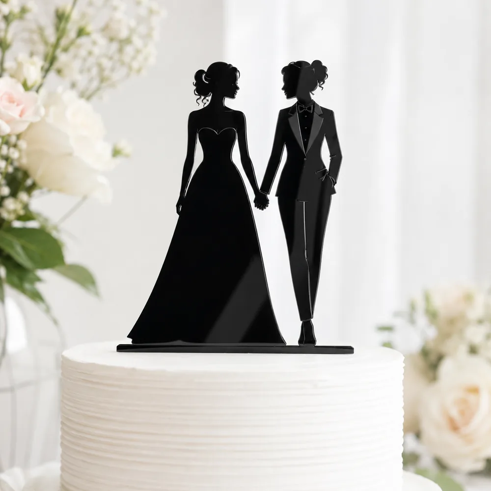 Black acrylic silhouette cake topper of a bride and groom holding hands