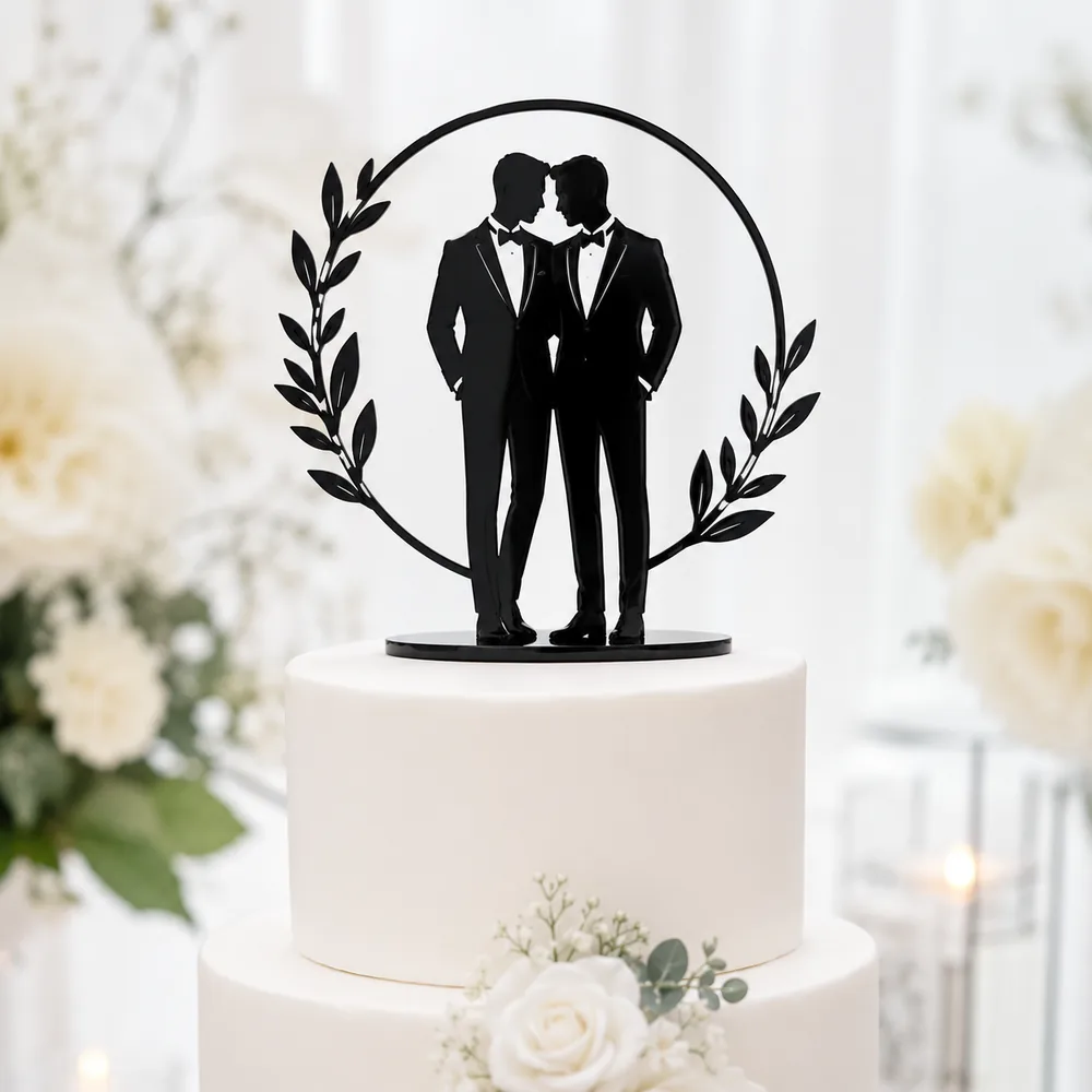 Black acrylic silhouette cake topper of two grooms framed by a laurel wreath